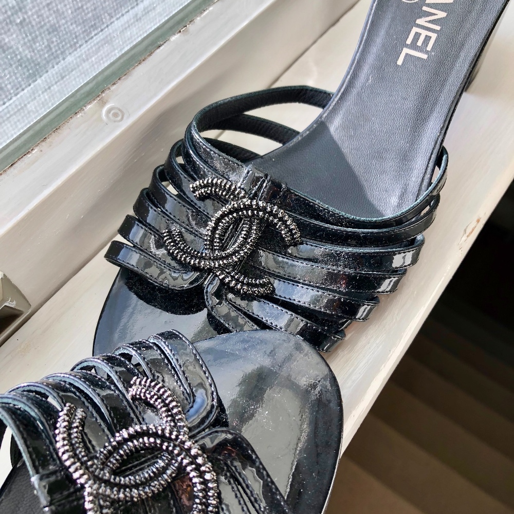 Black Chanel strap sandals, low heel.
